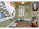 Brightly lit bonus room with hardwood floors and decorative accents and a window offering natural light at 6619 Livingston N Ave, St Petersburg, FL 33702