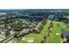 Beautiful community aerial view shows golf course, nearby homes, and mature landscaping at 9 Pelican Pl, Belleair, FL 33756