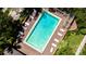 Overhead view of the community pool with surrounding landscaping at 9 Pelican Pl, Belleair, FL 33756