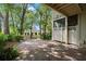 The home includes a secluded backyard with brick-lined pebble landscaping, a perfect spot for a tranquil escape at 9 Pelican Pl, Belleair, FL 33756
