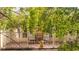 View of the balcony surrounded by trees, perfect spot to relax and enjoy the outdoor scenery at 9 Pelican Pl, Belleair, FL 33756