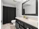 Stylish bathroom features a modern vanity, a shower with a curtain, and tiled flooring at 9 Pelican Pl, Belleair, FL 33756