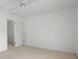 Neutral bedroom with a ceiling fan and white door at 9 Pelican Pl, Belleair, FL 33756
