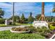 Community entrance with landscaping and signage at 9 Pelican Pl, Belleair, FL 33756