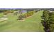 Scenic view of the meticulously maintained golf course, showcasing sand traps and vibrant green fairways at 9 Pelican Pl, Belleair, FL 33756