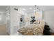 Bright kitchen featuring stainless appliances, granite countertops, and modern lighting fixtures at 9 Pelican Pl, Belleair, FL 33756