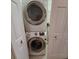 Stackable Samsung washer and dryer in the laundry room at 9 Pelican Pl, Belleair, FL 33756