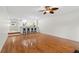 Open floor plan with hardwood flooring, breakfast bar, and barstool seating at 9 Pelican Pl, Belleair, FL 33756
