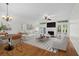 Bright living room with fireplace, modern furnishings, and a view to the outdoors at 9 Pelican Pl, Belleair, FL 33756