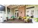 Enjoy the comfortable patio with wicker seating, perfect for outdoor gatherings and relaxation at 9 Pelican Pl, Belleair, FL 33756