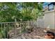 Charming brick patio surrounded by lush greenery, creating a private outdoor living space at 9 Pelican Pl, Belleair, FL 33756