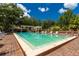 Beautiful community pool with seating areas, ideal for summer enjoyment at 9 Pelican Pl, Belleair, FL 33756
