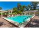 Inviting community pool with ample seating, perfect for relaxation and socializing at 9 Pelican Pl, Belleair, FL 33756
