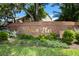 Pelican Place sign with lush greenery in a landscaped area at 9 Pelican Pl, Belleair, FL 33756