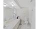 Clean bathroom with white vanity, bathtub, and shower at 1385 Embassy Dr, Clearwater, FL 33764