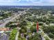 Aerial view of house with pool, city skyline in the distance at 6619 Livingston N Ave, St Petersburg, FL 33702
