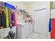 Bright laundry room with washer, dryer, and ample storage at 1905 Masters Way, Plant City, FL 33566