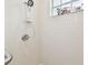 Clean shower with white tile, handheld showerhead, and grab bar at 1905 Masters Way, Plant City, FL 33566
