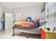 Bedroom with colorful bedding and a yellow dresser at 1905 Masters Way, Plant City, FL 33566