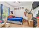 bedroom with baseball theme, TV and dresser at 1905 Masters Way, Plant City, FL 33566
