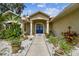 One-story house with blue front door and walkway at 1905 Masters Way, Plant City, FL 33566