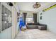 Cozy bedroom with gray sofa and rocking chair at 1905 Masters Way, Plant City, FL 33566