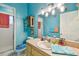 Bathroom with light blue walls, a single sink vanity, and shower/tub combo at 1905 Masters Way, Plant City, FL 33566