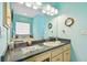 Bathroom with a large vanity, granite countertop, and a soaking tub at 1905 Masters Way, Plant City, FL 33566