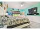 Main bedroom with a large bed, lots of natural light and a TV at 1905 Masters Way, Plant City, FL 33566
