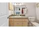 Clean bathroom with a single sink vanity and plenty of storage at 1905 Masters Way, Plant City, FL 33566