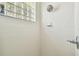 Clean bathroom with a walk-in shower and a glass block window at 1905 Masters Way, Plant City, FL 33566
