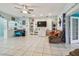 Living area with tiled floors, built-in shelving and a TV at 1905 Masters Way, Plant City, FL 33566