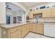 L-shaped kitchen with white appliances at 1905 Masters Way, Plant City, FL 33566