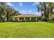 House exterior with large backyard and lush landscaping at 1905 Masters Way, Plant City, FL 33566