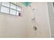 Clean shower stall with white tile and handheld showerhead at 1905 Masters Way, Plant City, FL 33566