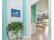 Hallway with a plant and a view into a bedroom at 1905 Masters Way, Plant City, FL 33566