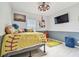 Softball-themed bedroom with a queen bed and plenty of storage at 1905 Masters Way, Plant City, FL 33566