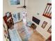 Elevated view of living room with fireplace and TV at 2669 Sequoia Ter, Palm Harbor, FL 34683