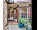 Front entrance with a white door and potted plants at 2669 Sequoia Ter, Palm Harbor, FL 34683