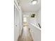 Clean hallway with tile floors and linen closet at 1655 58Th S Ter # 1, St Petersburg, FL 33712