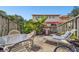 Private backyard patio with seating, grill, and lounge chair at 1655 58Th S Ter # 1, St Petersburg, FL 33712
