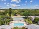 Community pool with lounge chairs and surrounding homes at 1655 58Th S Ter # 1, St Petersburg, FL 33712