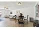 Living room features a sofa, chairs, and access to a patio or backyard at 1655 58Th S Ter # 1, St Petersburg, FL 33712
