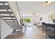 Spacious living room with a view of a patio and staircase at 1655 58Th S Ter # 1, St Petersburg, FL 33712