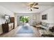 Living area showcasing a comfortable seating arrangement and access to a patio at 1655 58Th S Ter # 1, St Petersburg, FL 33712