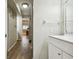 Clean bathroom with a white vanity, tile shower, and bathtub at 1655 58Th S Ter # 1, St Petersburg, FL 33712
