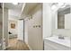 Bright bathroom with white vanity and view of bedroom at 1655 58Th S Ter # 1, St Petersburg, FL 33712
