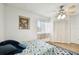 Bedroom with a double bed, built-in closet, and tile floor at 1655 58Th S Ter # 1, St Petersburg, FL 33712