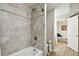 Bathroom featuring a tub and shower with tile surround at 1655 58Th S Ter # 1, St Petersburg, FL 33712