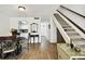 Dining area with kitchen view, showcasing a round table and chairs at 1655 58Th S Ter # 1, St Petersburg, FL 33712